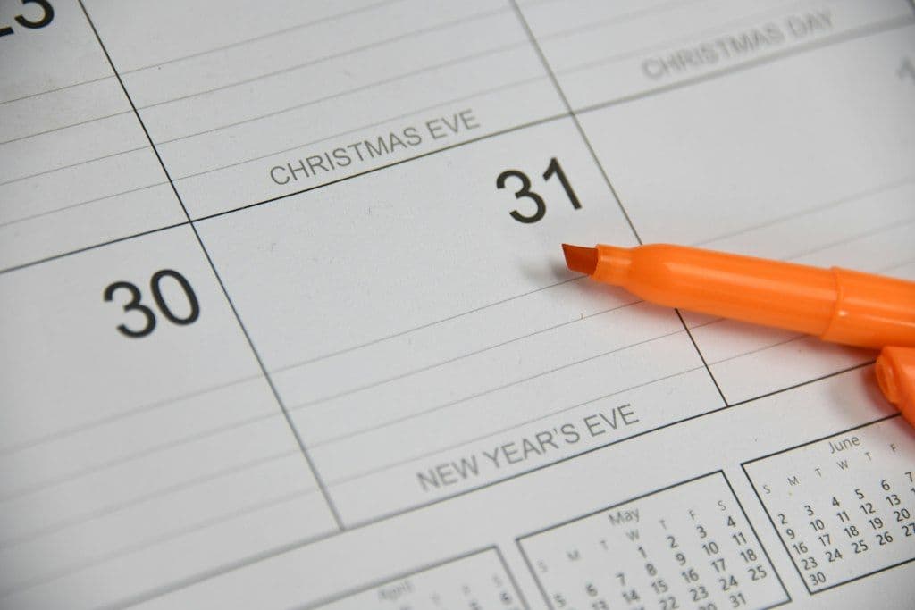 A calendar page for the end of December with an orange marker next to Christmas Eve